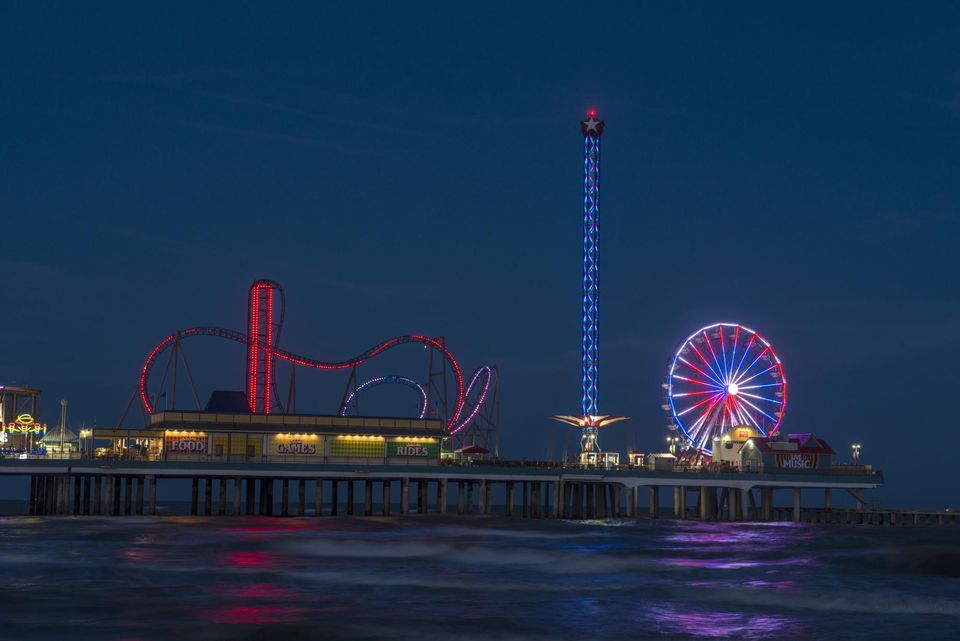 The Pleasure Pier at dusk from the Gulf shore