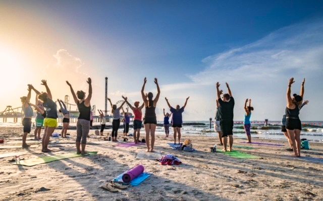 Sunrise yoga on the sand